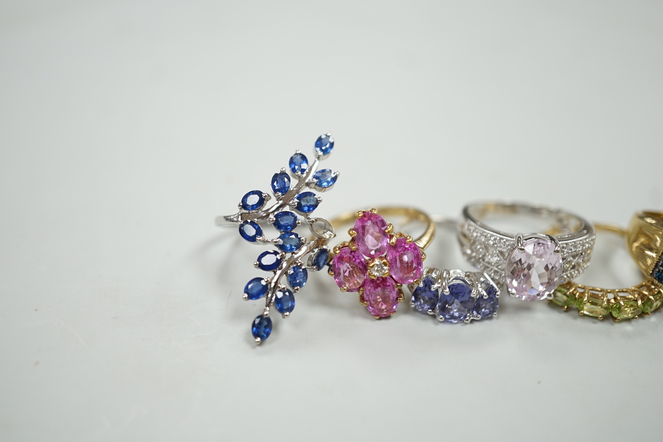Six assorted modern 9ct gold and gem set dress rings, including three white gold, gross weight 20 grams.